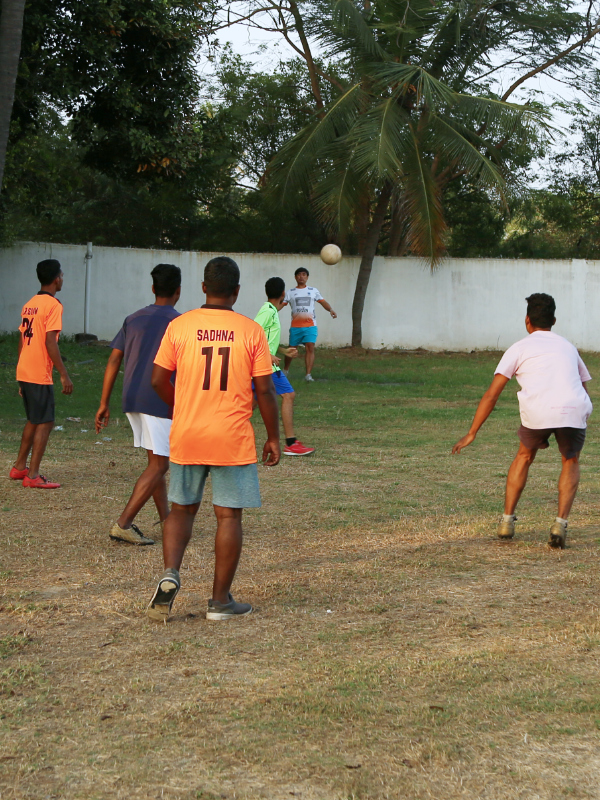Student Playing football together